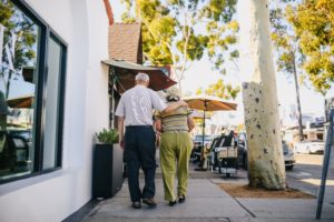 Old Man and woman walking in the street